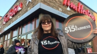 Demonstrators picket Tim Hortons after cuts to employee benefits